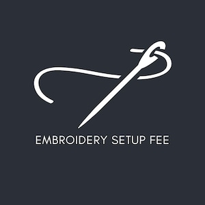 May include: White needle and thread graphic on a dark gray background. The text "EMBROIDERY SETUP FEE" is displayed below the graphic. The needle is angled, with the thread forming a curved line.