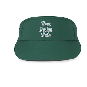 May include: A dark green, five-panel cap with a curved brim. The cap features the embroidered text "Your Design Here" in white script across the front panel. The cap is designed with a low profile and a structured fit.