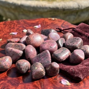 May include: A set of three ceramic mugs with a speckled, matte finish. Each mug features a different color: light blue, cream, and gray. The mugs have a simple, modern design and a comfortable handle.