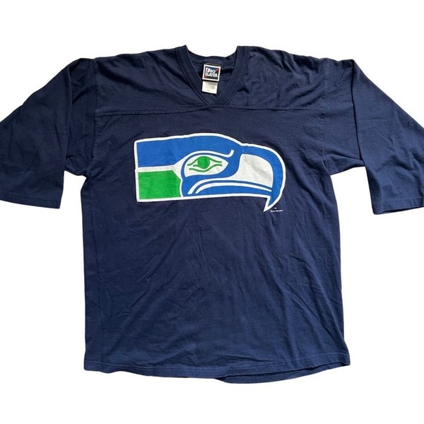 Vintage 1996 NFL Seattle Seahawks Pro Player large logo half sleeve crewneck shirt, tag size X-Large. Made of 100% Cotton and boxy fit.