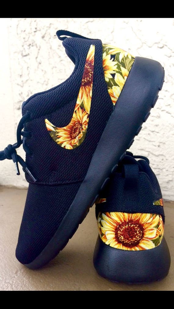 black nike shoes with flowers