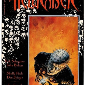May include: A comic book titled Clive Barker's Hellraiser, Book 1. The cover features a black border with white skull patterns and red text. A central illustration depicts a pale, pin-headed figure holding a glowing puzzle box against a fiery orange background.