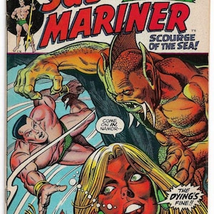 May include: Vintage Sub-Mariner comic book cover. The cover features a dynamic illustration of Namor the Sub-Mariner in a battle scene with a sea creature. Bold text reads "Sub-Mariner" and "It Strikes From The Stars!"