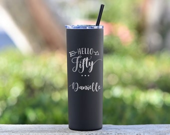 May include: Black stainless steel tumbler with a white inscription that reads "Hello Fifty... Danielle".