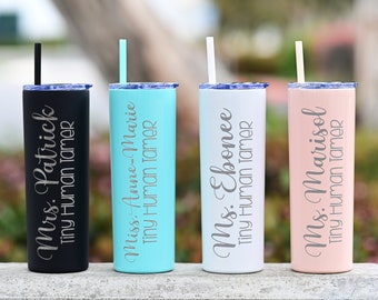May include: Four stainless steel tumblers with straws, each with a different color and personalized text. The text on the tumblers reads "Mrs. Patrick Tiny Human Tamer", "Miss. Anne-Marie Tiny Human Tamer", "Ms. Ebonee Tiny Human Tamer", and "Ms. Marisol Tiny Human Tamer".