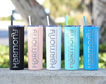 May include: Five stainless steel tumblers with straws, each featuring a different color: black, pink, white, turquoise, and blue. The tumblers are engraved with the text "Harmony Pediatric Dentistry & Orthodontics".