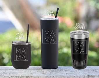 May include: Three black stainless steel tumblers with a white graphic that says "MA MA" and "EST 2022". The tumblers are 12 oz, 20 oz skinny, and 20 oz coffee.