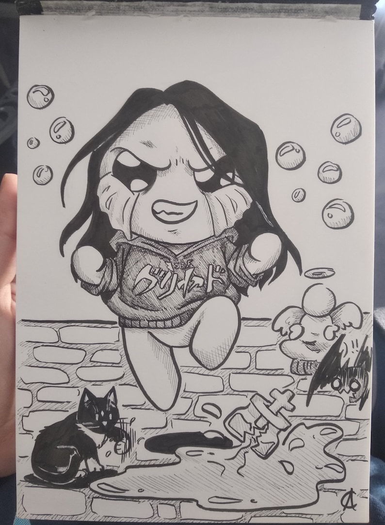 May include: Black and white ink drawing of a cartoon character with long black hair, wearing a hoodie with Japanese text. The character is crying and jumping over a puddle. A cat and angel are also in the drawing.