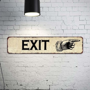 May include: A vintage-style metal sign with a distressed white background and black text that reads "EXIT". A black and white illustration of a hand pointing to the right is on the right side of the sign.
