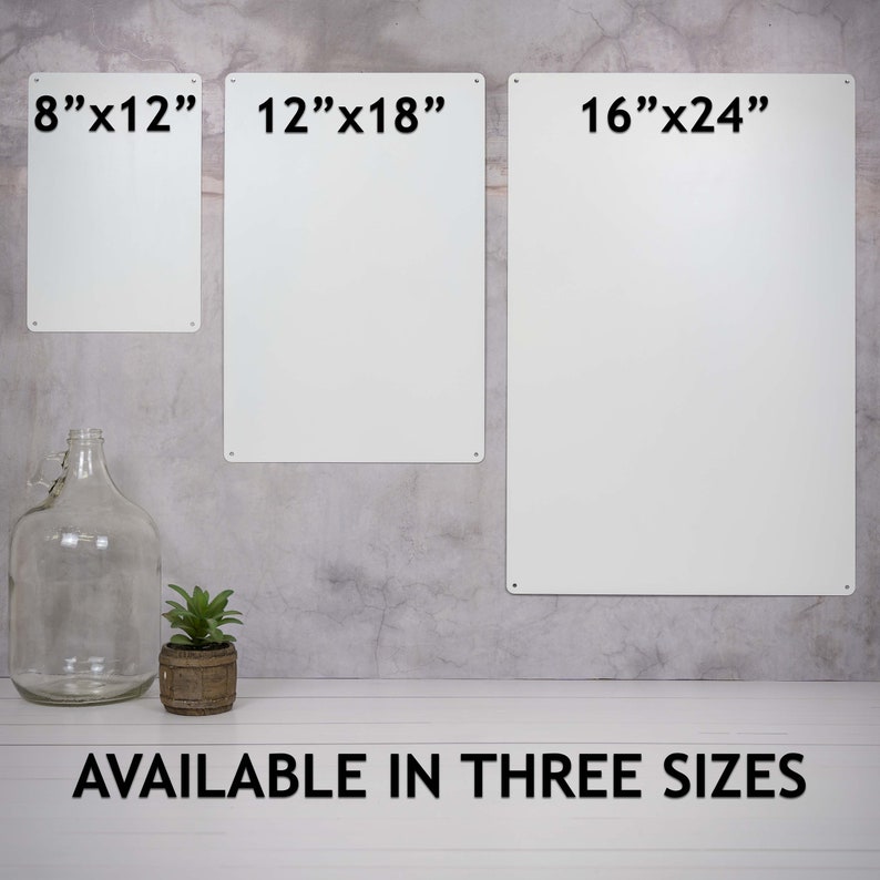 May include: Three metal signs with different sizes: 8 inches by 12 inches, 12 inches by 18 inches, and 16 inches by 24 inches. The signs are white and have black text. The text on the signs reads "8"x12", "12"x18", and "16"x24". The signs are hanging on a gray wall. The text "AVAILABLE IN THREE SIZES" is printed on a white surface below the signs.