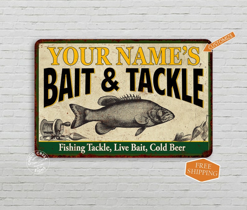 May include: A vintage-style metal sign with a green border and a white background. The sign says "Your Name's Bait & Tackle" in black and yellow text. There is a black and white illustration of a fish on the sign. The text "Fishing Tackle, Live Bait, Cold Beer" is printed in black at the bottom of the sign.
