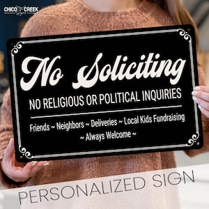 May include: Black rectangular sign with white text. The sign reads "No Soliciting" and "No Religious or Political Inquiries." It also states "Friends ~ Neighbors ~ Deliveries ~ Local Kids Fundraising ~ Always Welcome." The words "Personalized Sign" are at the bottom.