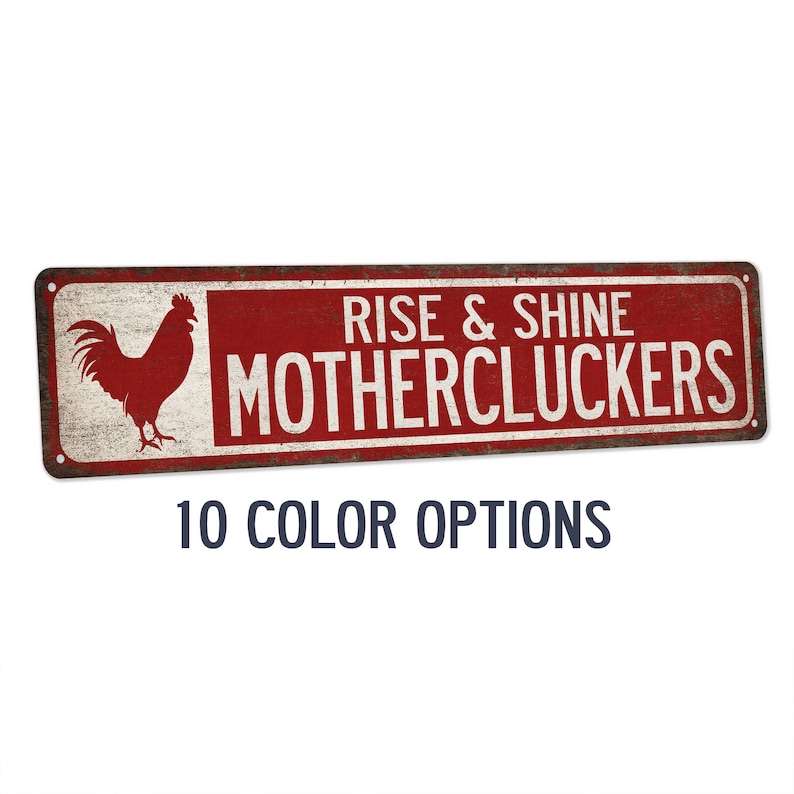 May include: Red and white metal sign with a rooster illustration and the text "Rise & Shine Mothercluckers". The sign has a distressed, vintage look.