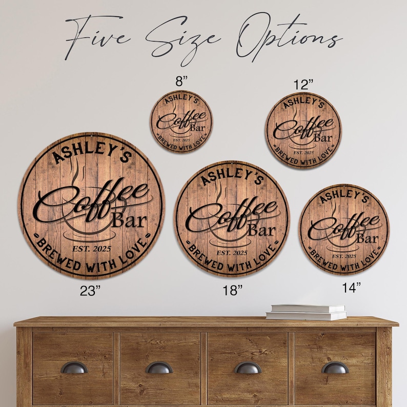 May include: Five round wooden signs with the text "Ashley's Coffee Bar" and "Brewed with Love." Sizes include 8", 12", 14", 18", and 23" diameter. The signs are brown with black lettering and a coffee cup graphic.