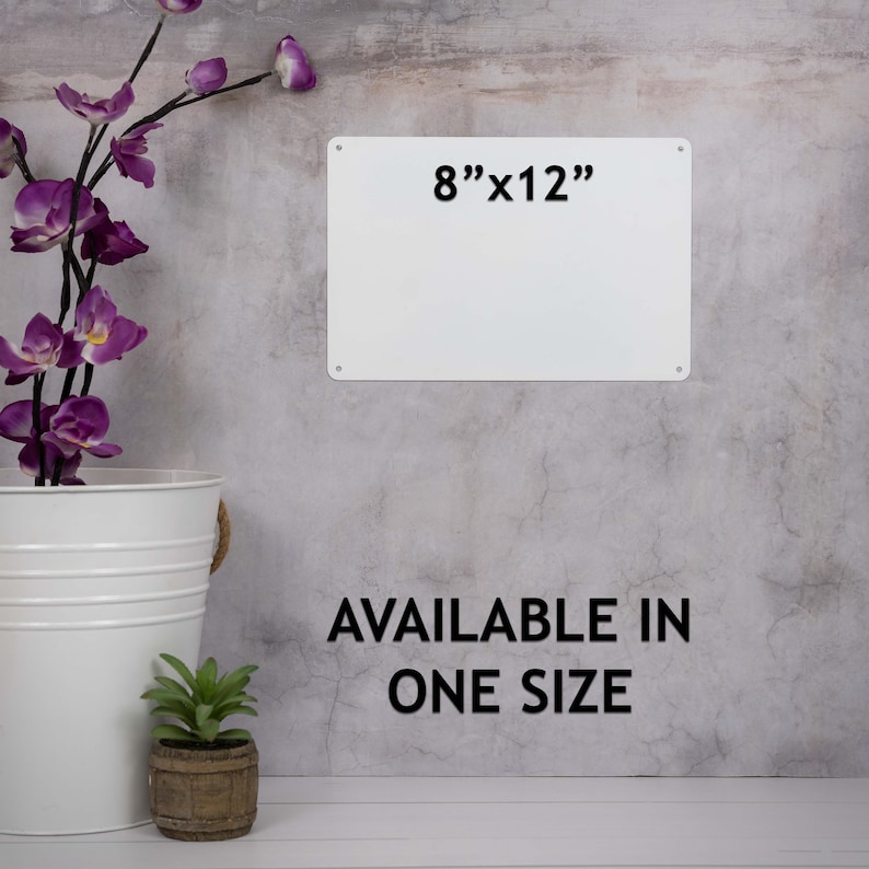 May include: White metal sign with black text that reads "8"x12" Available in one size". The sign is hanging on a gray textured wall.