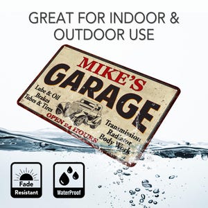 May include: A vintage-style metal sign with the text "Mike's Garage" in red and black lettering. The sign features a cartoon image of a classic car and the text "Open 24 Hours" with services listed below. The sign is water-resistant and fade-resistant.