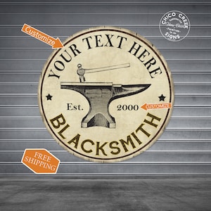 May include: A round, rustic sign with a black and white illustration of a blacksmith's anvil and hammer. The sign has a tan background with black text that reads "YOUR TEXT HERE", "Est. 2000", and "BLACKSMITH".