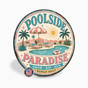 May include: A round metal sign featuring a poolside scene with palm trees, lounge chairs, a sun umbrella, and a swimming pool. The text reads POOLSIDE PARADISE, SWIM SIP SUN, and REPEAT DAILY. A small circular sticker with the US flag is attached.