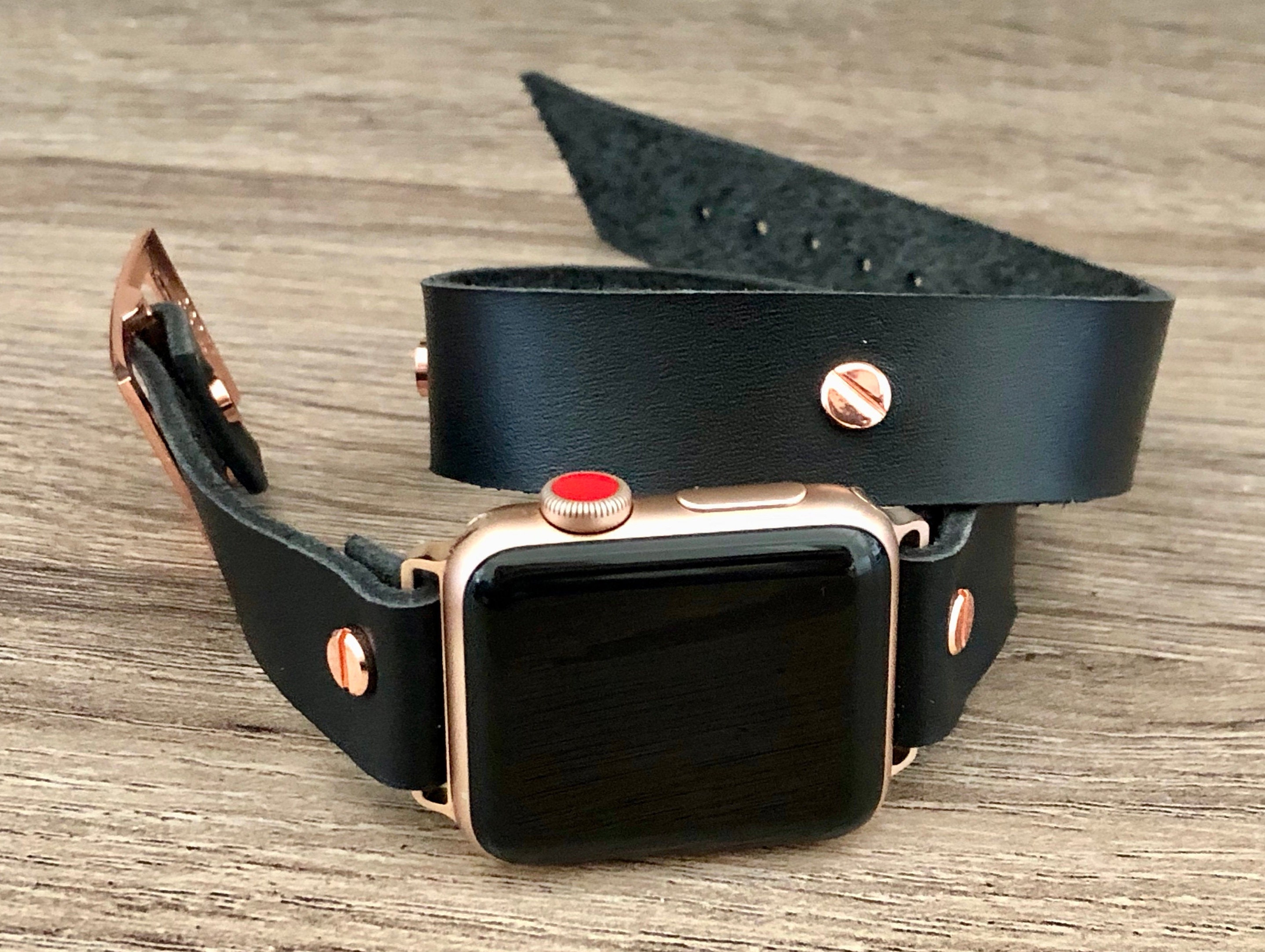 rose gold apple watch with black strap