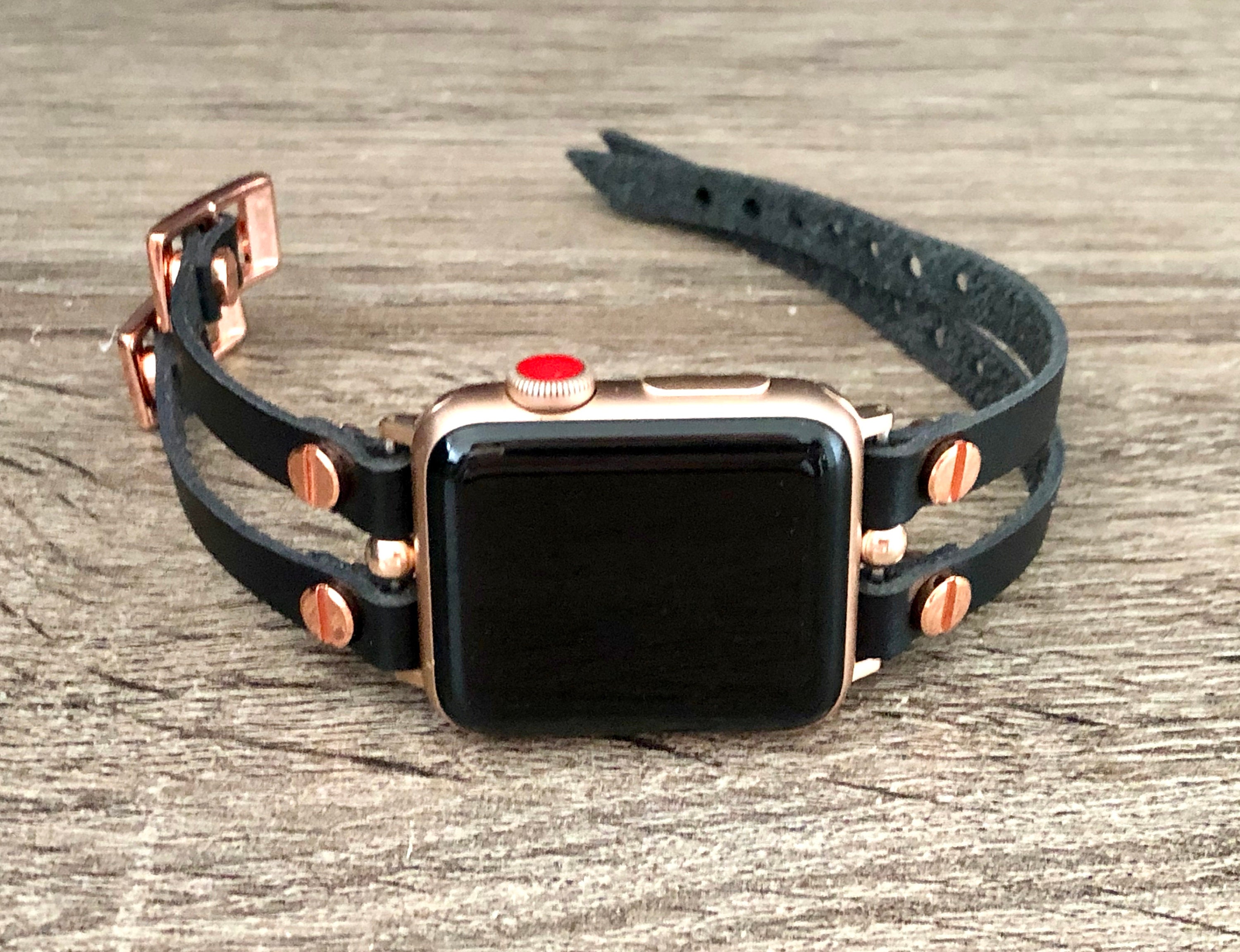 rose gold apple watch with black strap