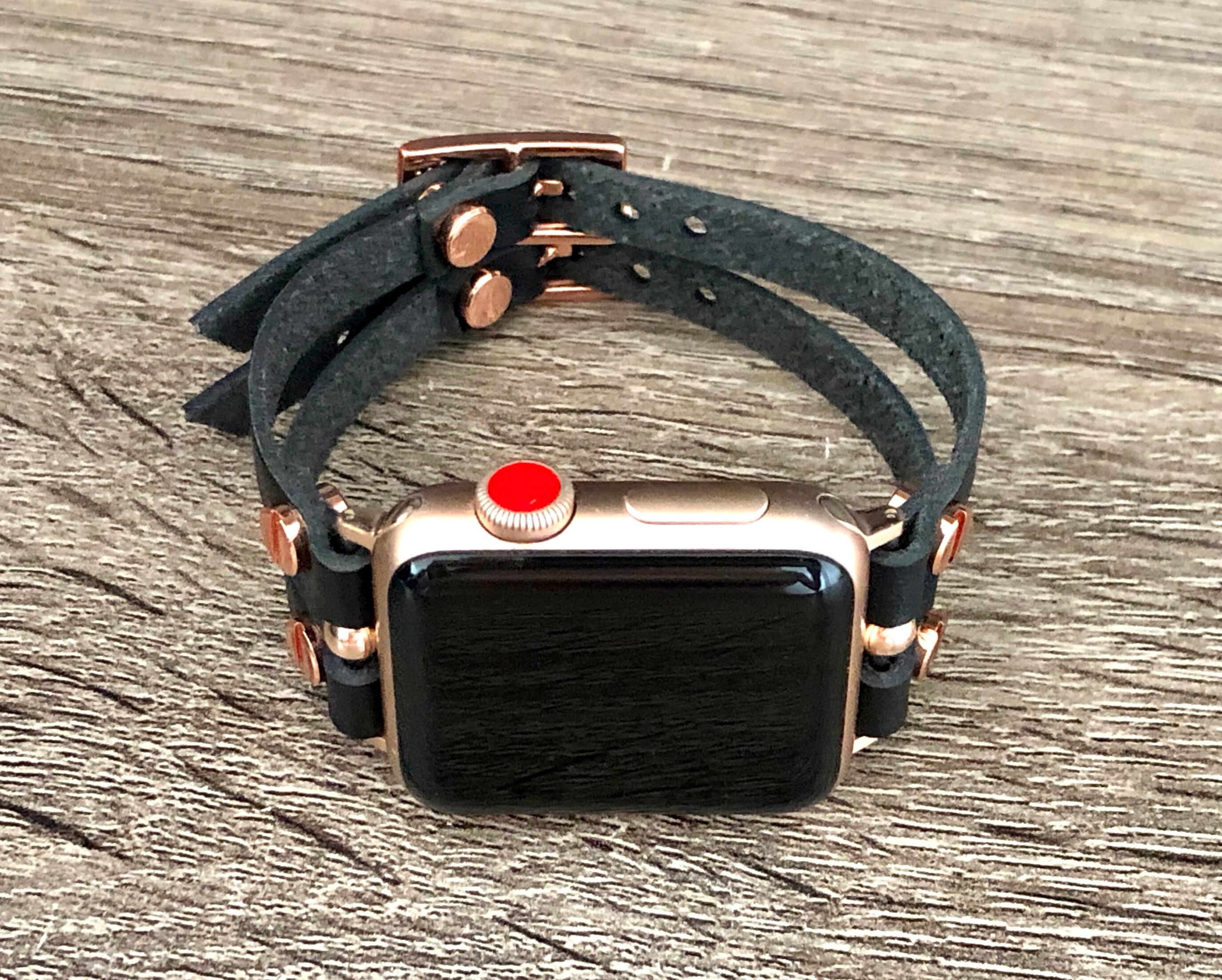 rose gold apple watch with black strap