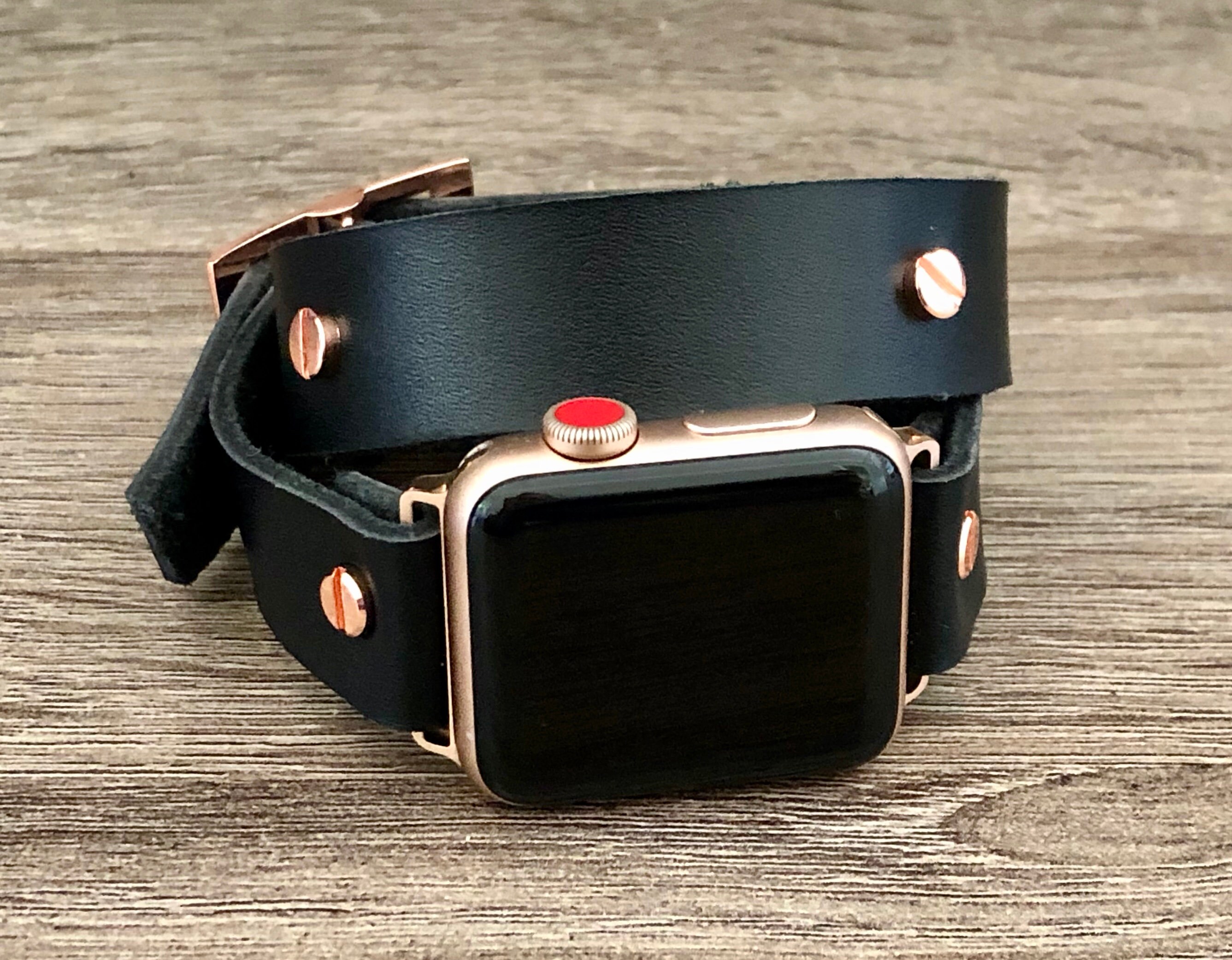 rose gold apple watch with black strap