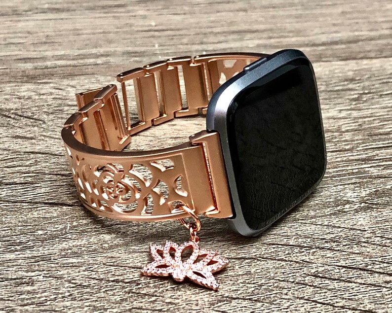 rose gold fitbit versa with different bands