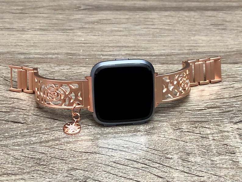 orange fitbit versa band