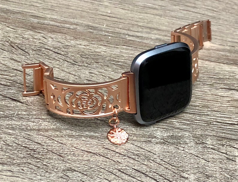 versa rose gold with black band