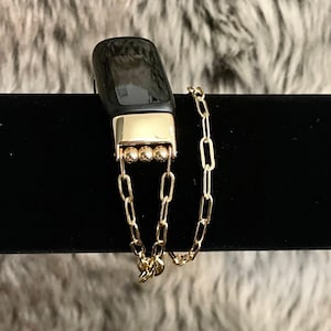 Pulsera Fitbit Inspire 3 con doble vuelta y relleno de oro de 14 quilates y clip de papel