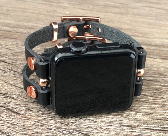 space gray apple watch with gold band