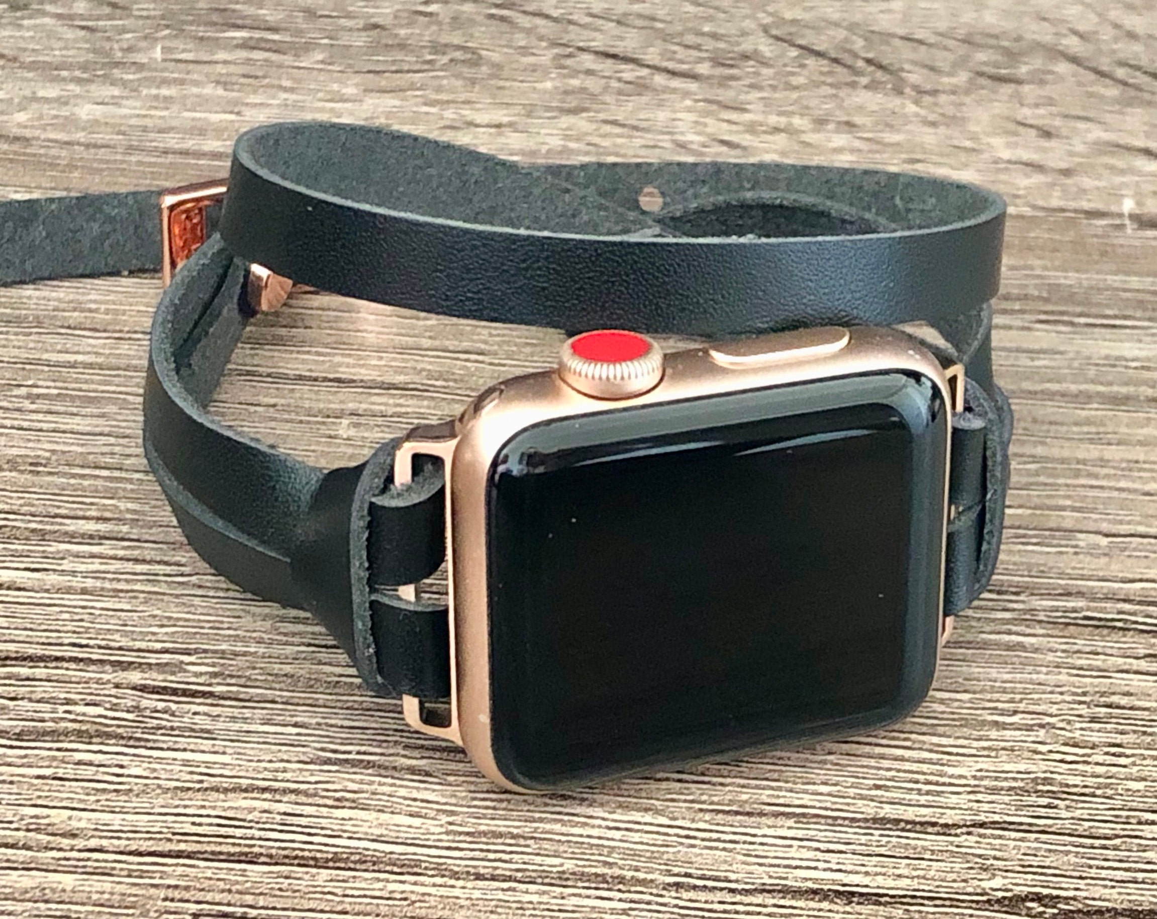rose gold apple watch with black strap
