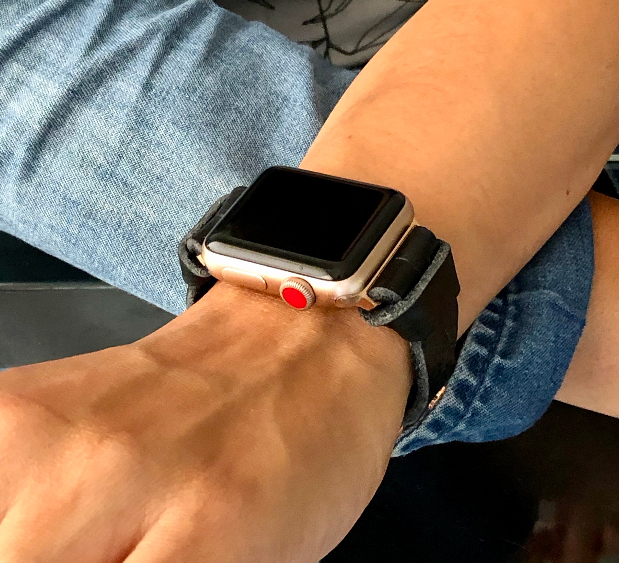 rose gold apple watch with black strap