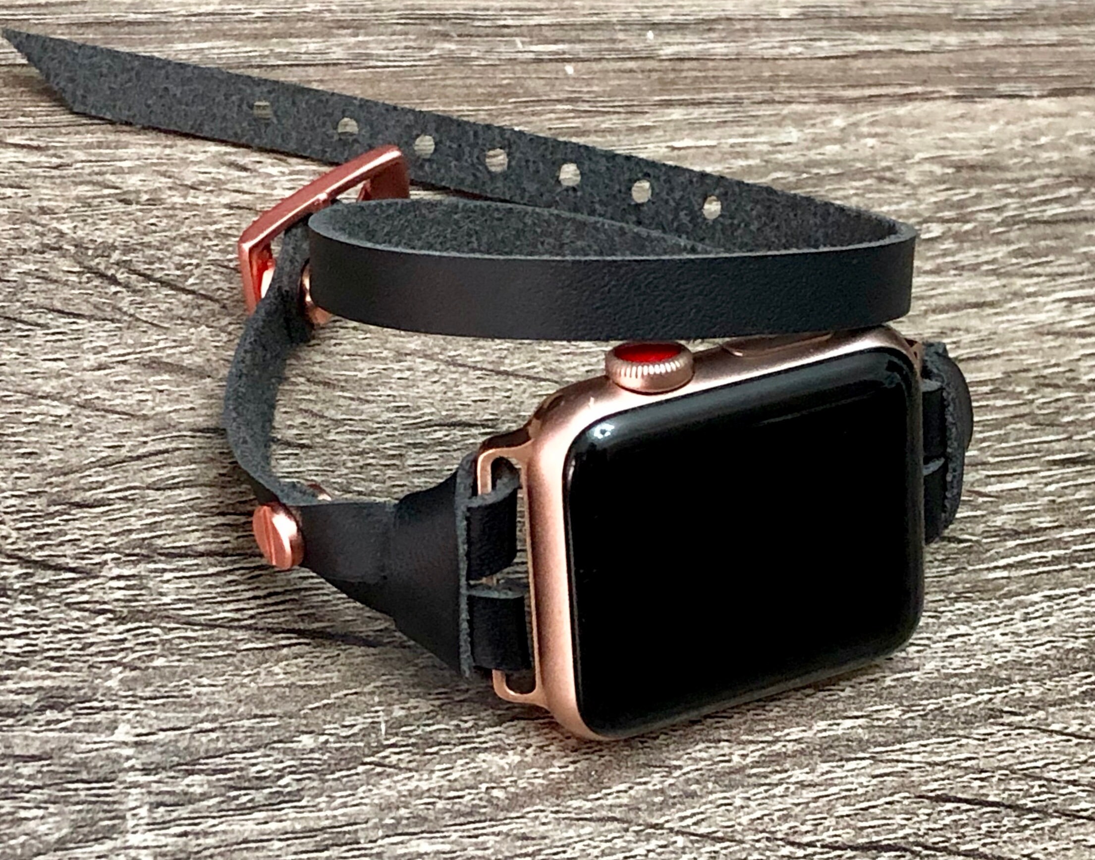 rose gold apple watch with black strap