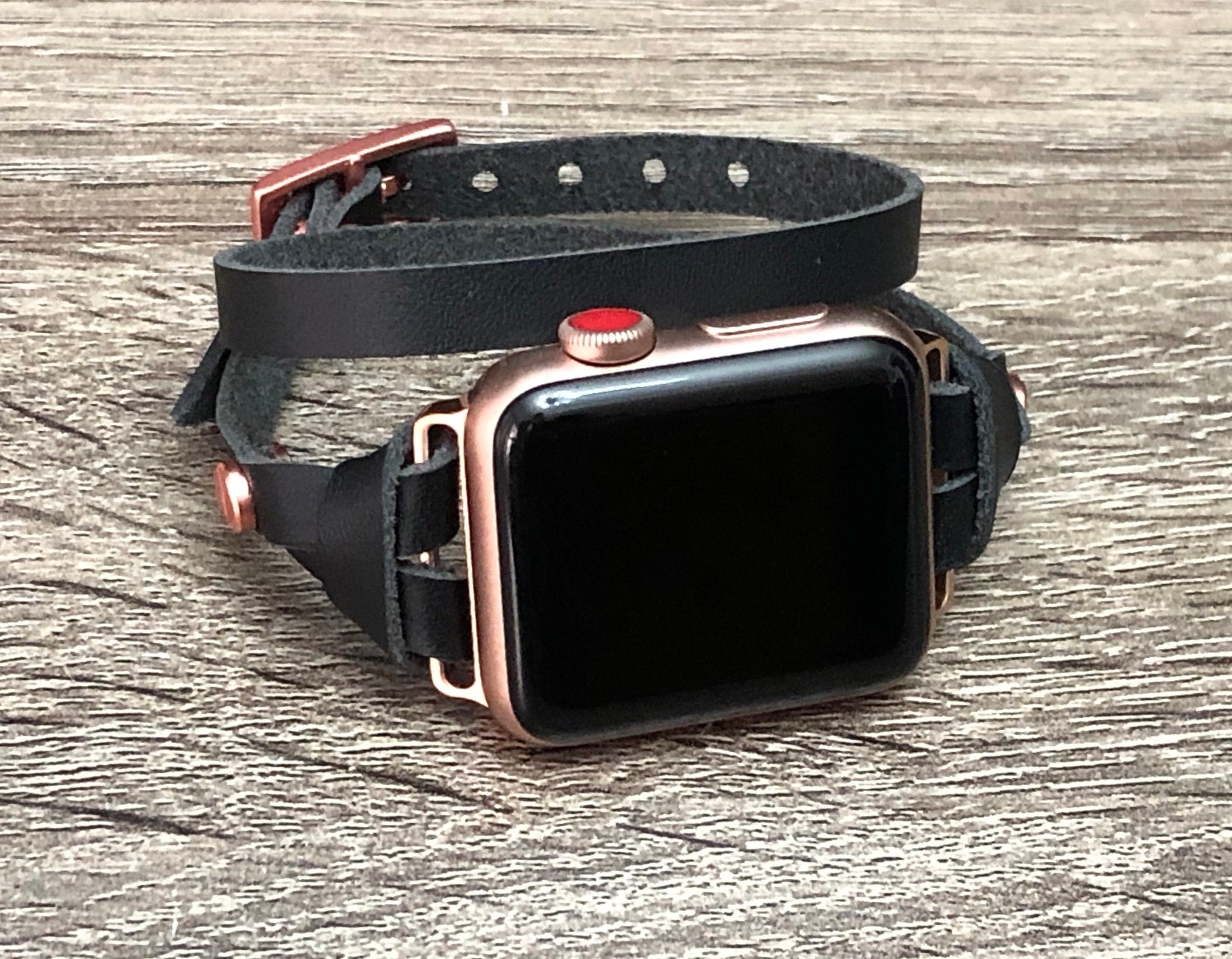 rose gold apple watch with black strap