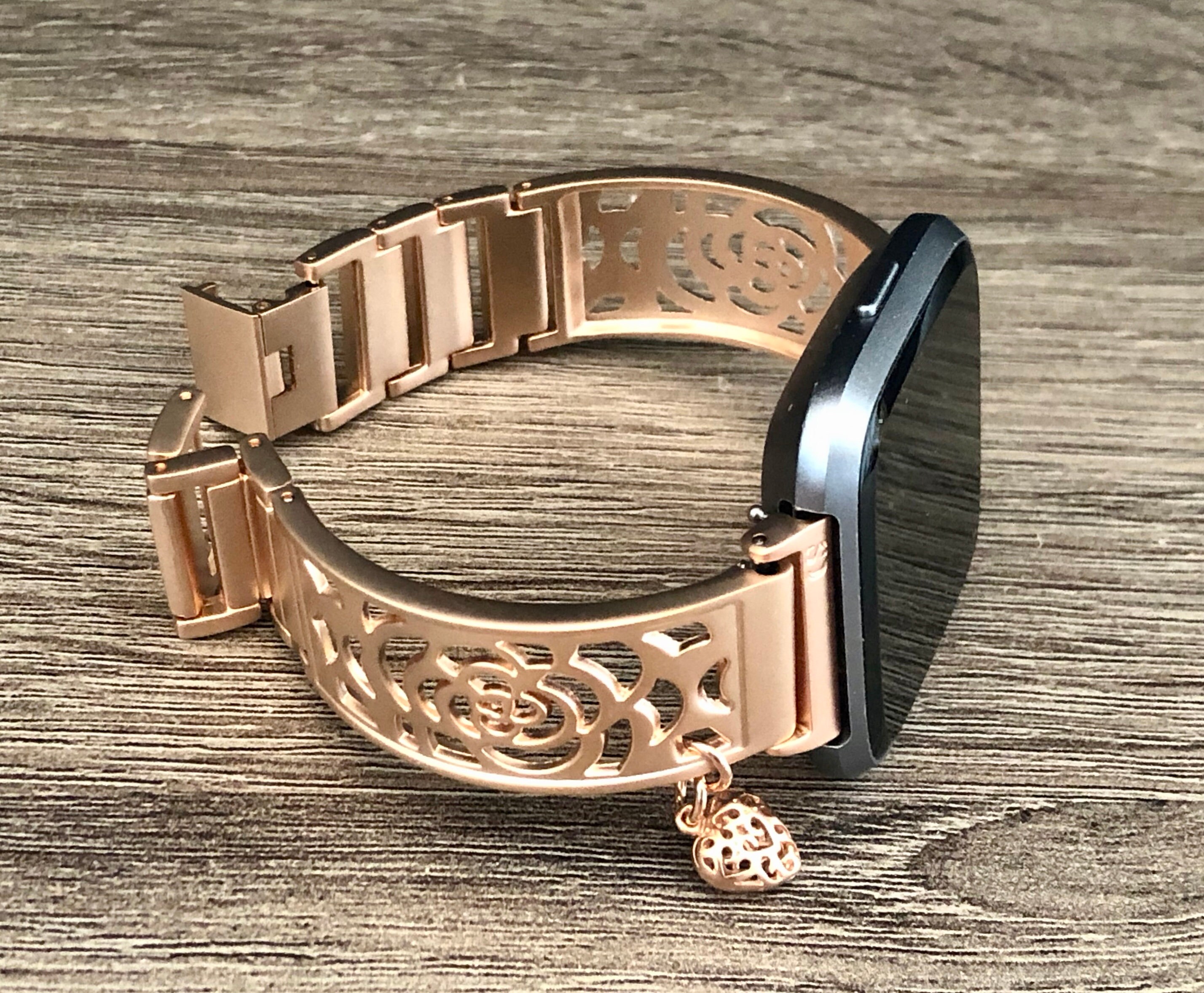 versa rose gold with black band