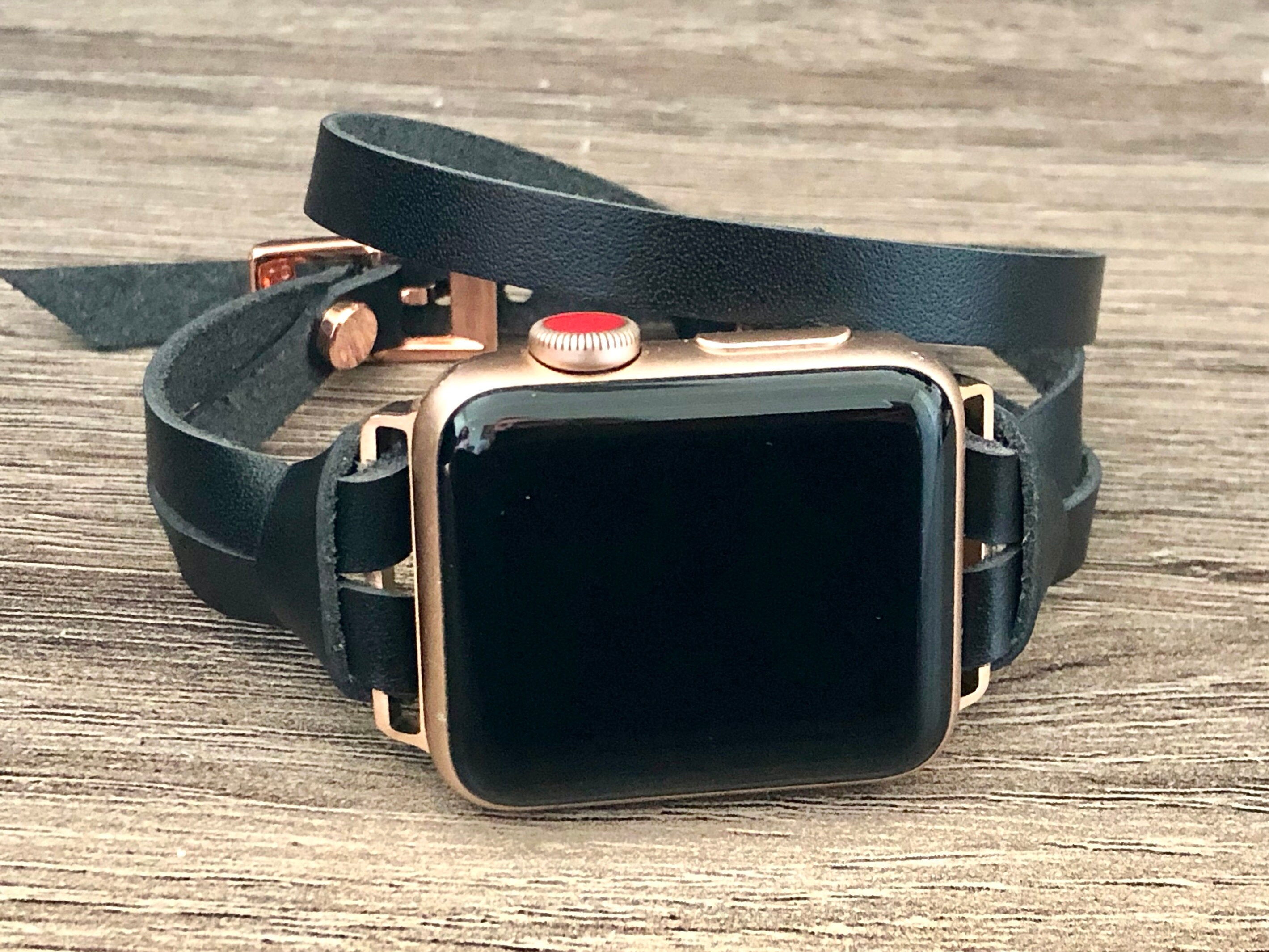rose gold apple watch with black strap