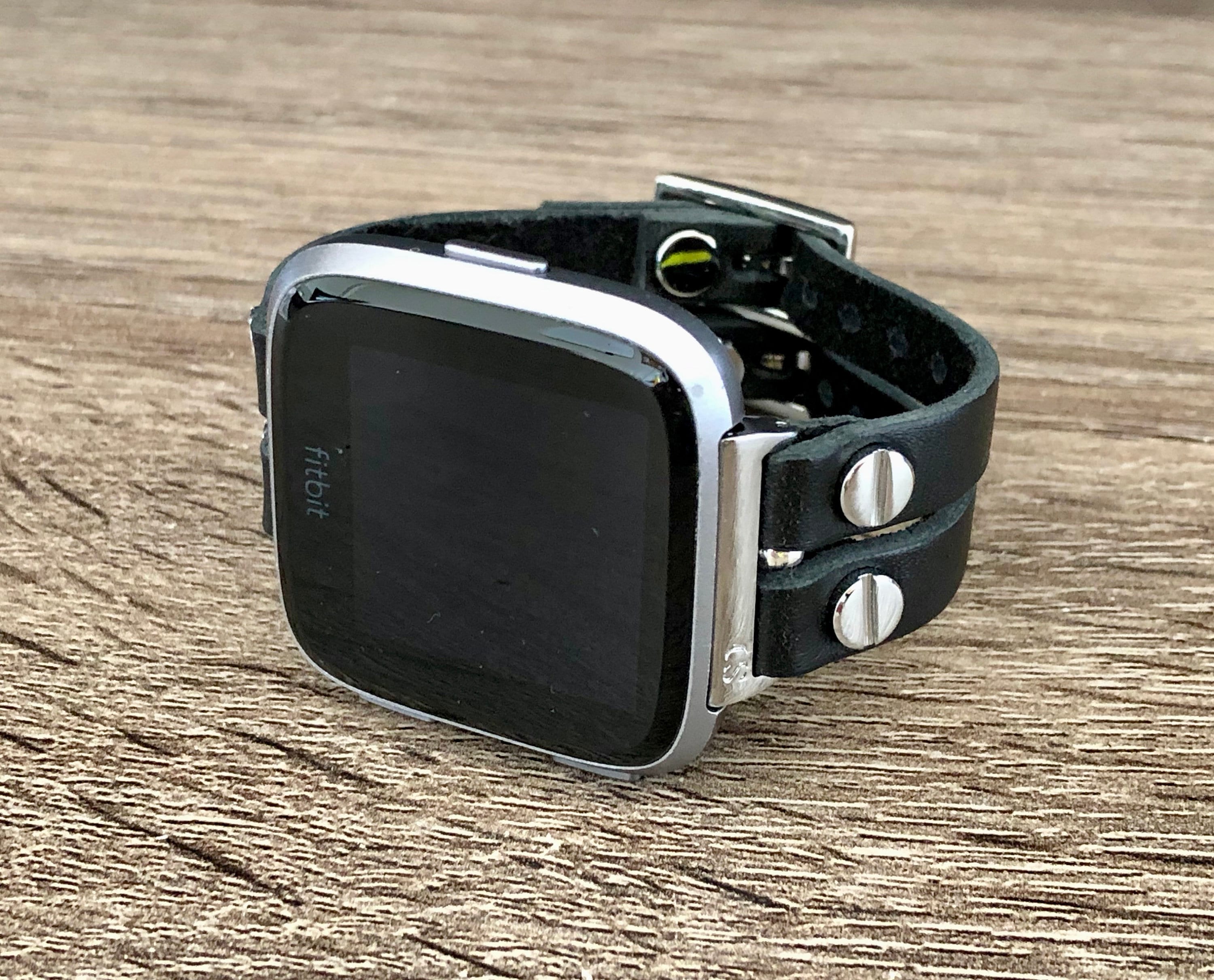 silver fitbit versa with black band