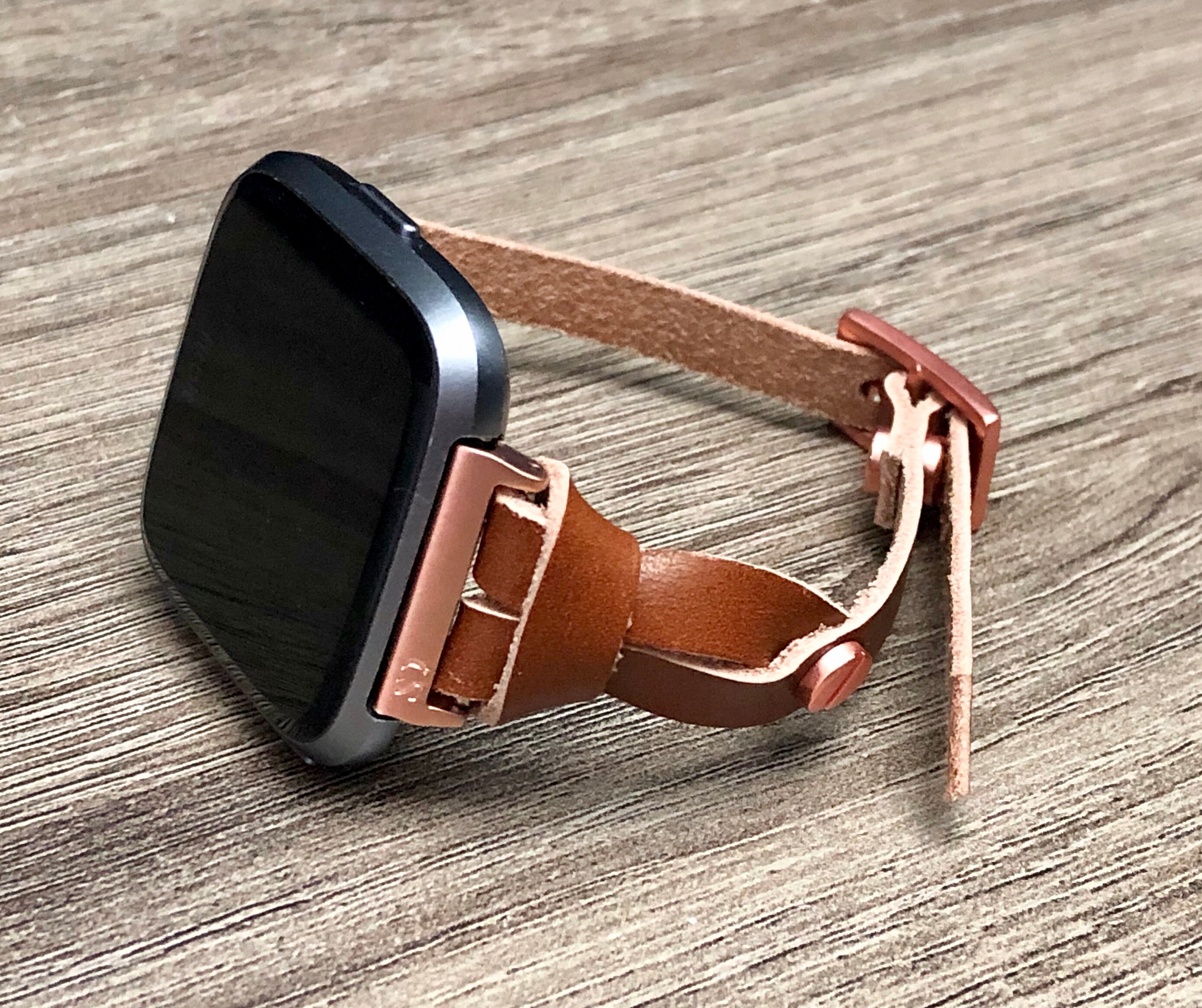 rose gold fitbit versa with different bands