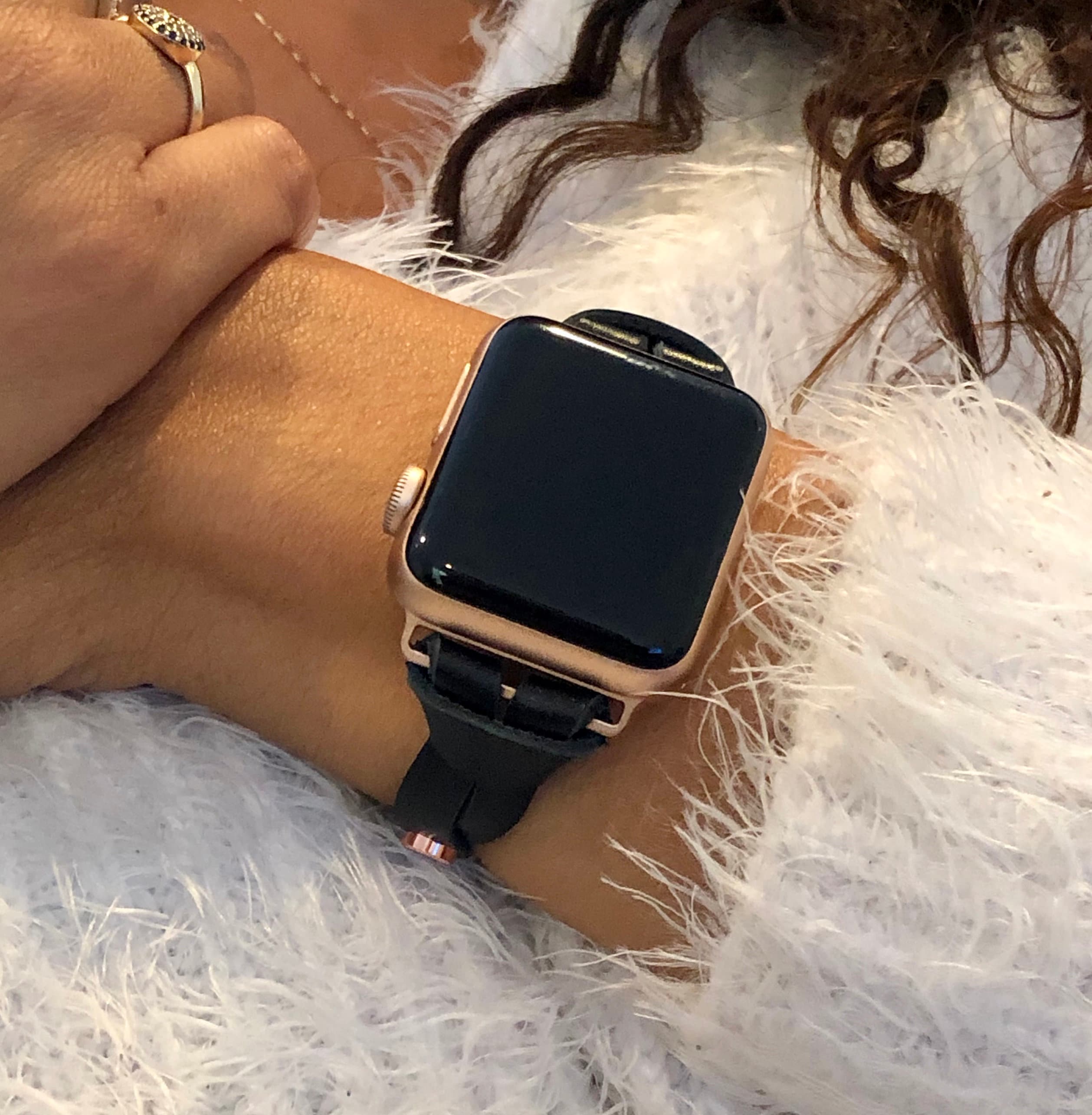 rose gold apple watch with black strap