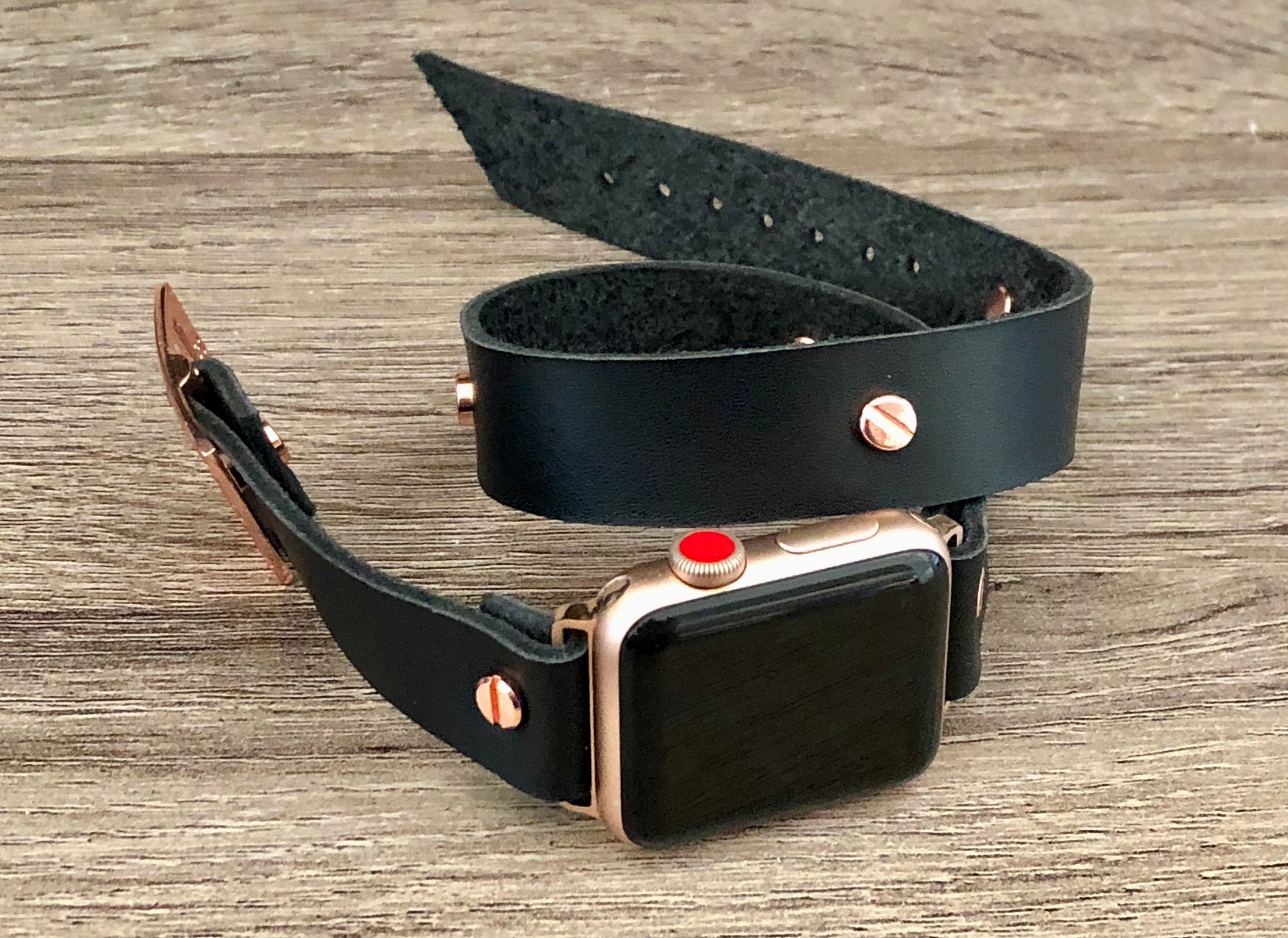 rose gold apple watch with black strap