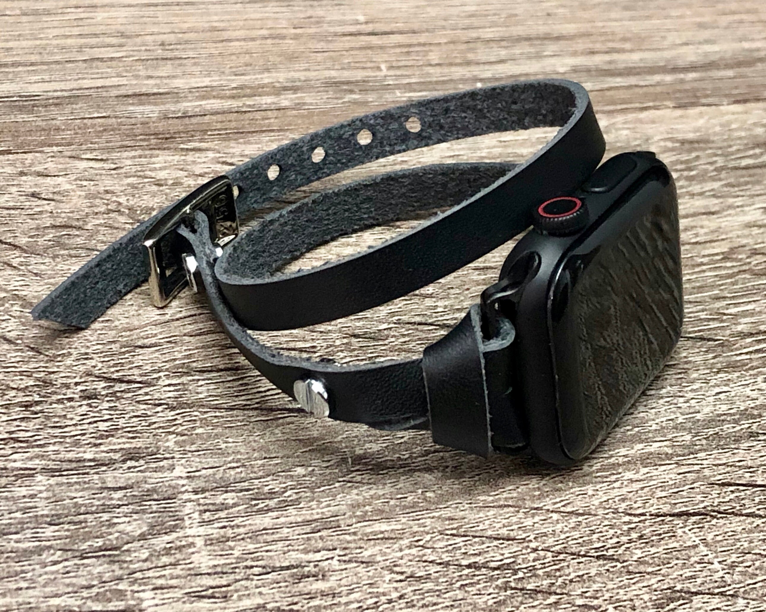 space gray apple watch with leather band