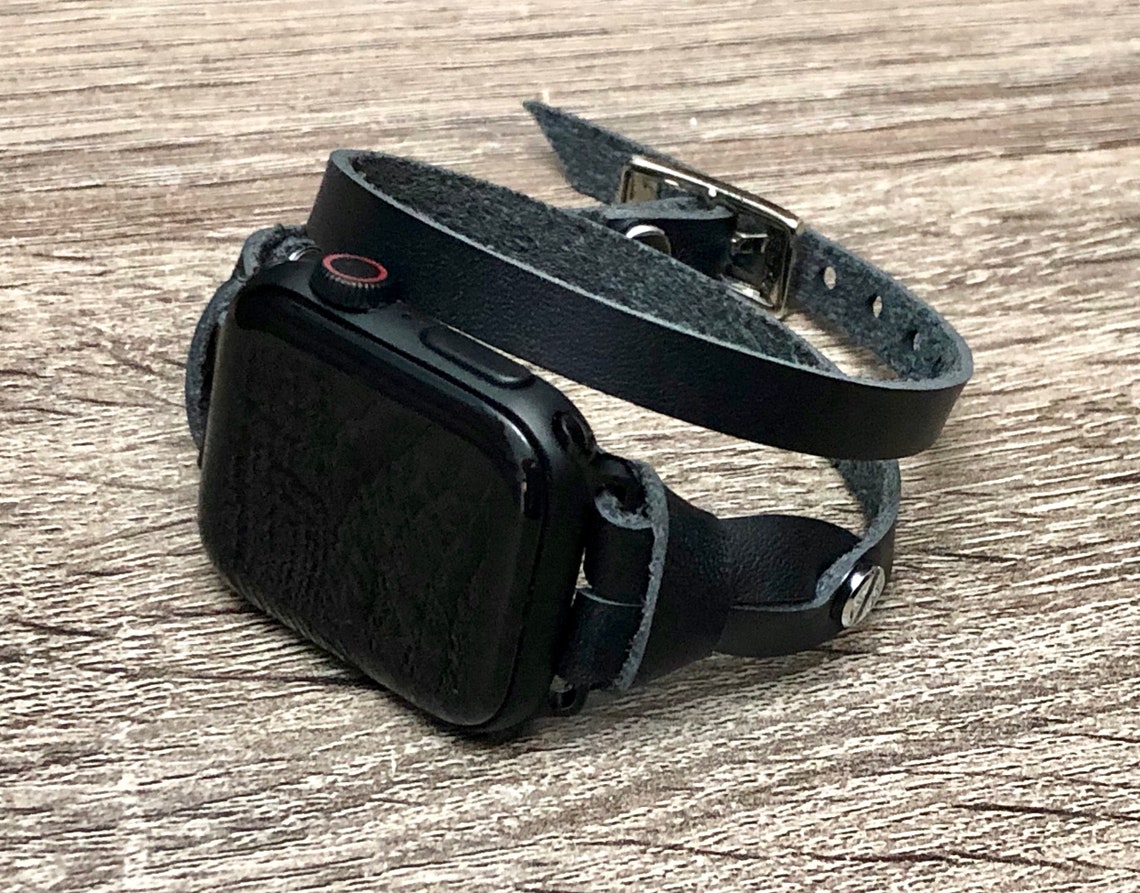 space grey apple watch with silver link bracelet