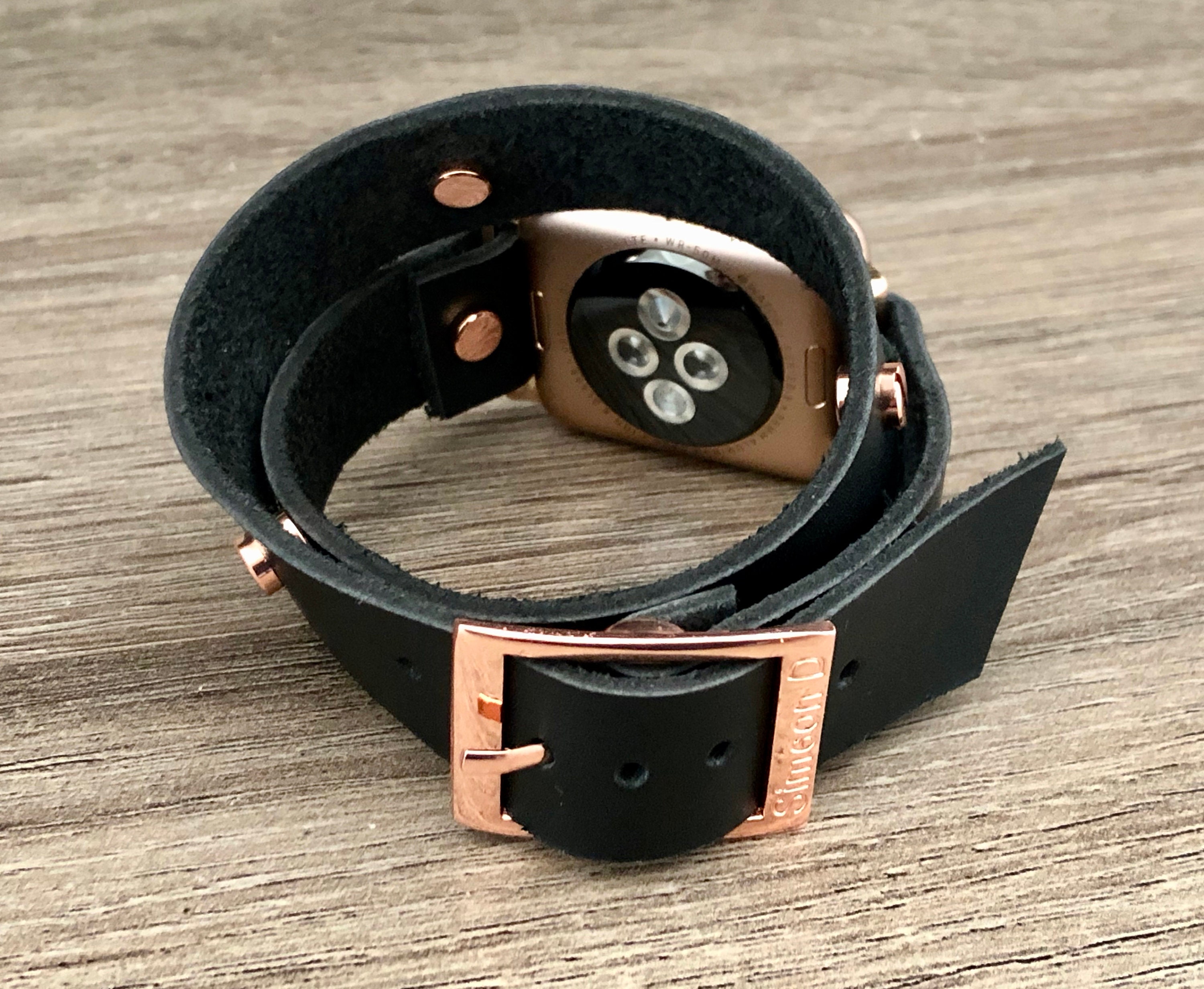 rose gold apple watch with black strap