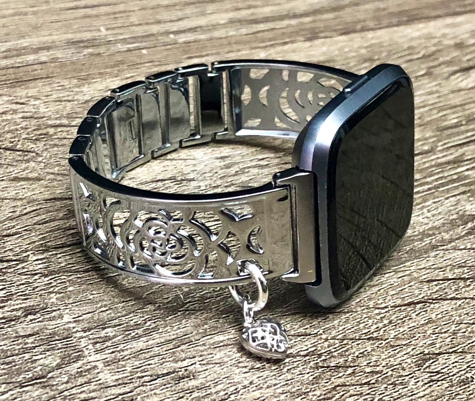 silver fitbit versa with black band