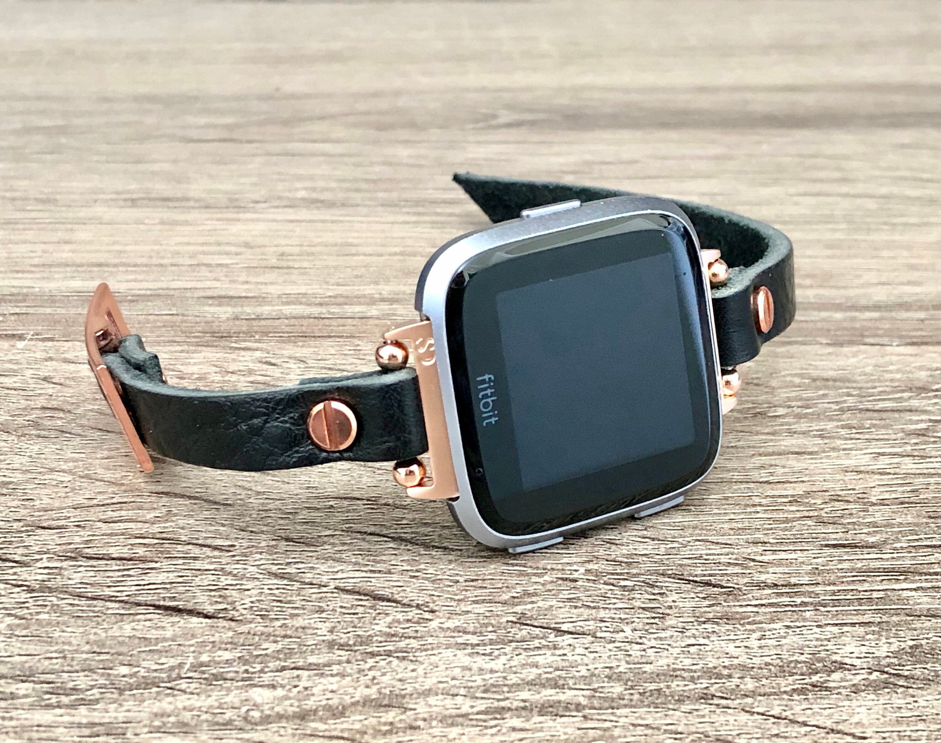 versa rose gold with black band