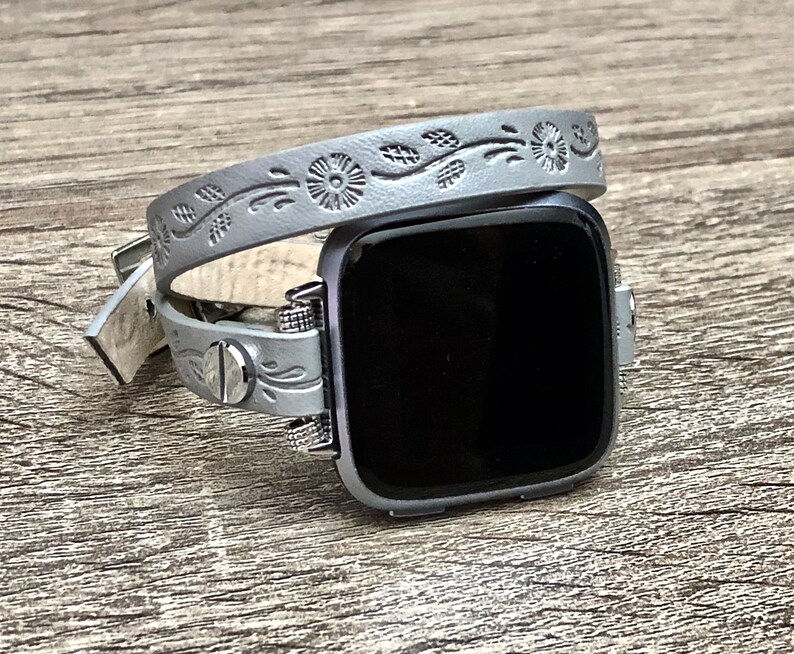 grey silver fitbit versa