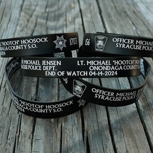 Officer Michael Jensen and Lt. Michael Hoosock memorial bracelets with the proceeds going to the families.