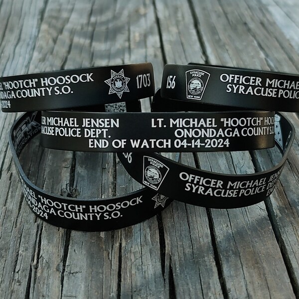 Officer Michael Jensen and Lt. Michael Hoosock memorial bracelets with the proceeds going to the families.