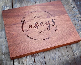Sapele Cutting Board with your family name and established date.